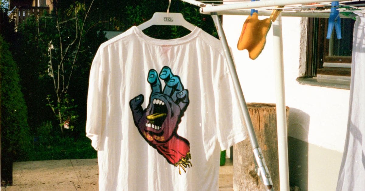 white t-shirt on clothes rack